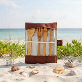 Bamboo cutlery set with fork, knife, spoon, straw, cleaning brush, and cotton pouch for sustainable dining